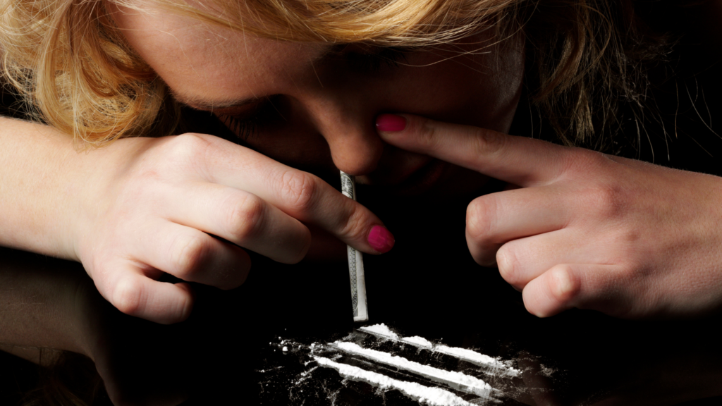 Image of a person snorting Cocaine